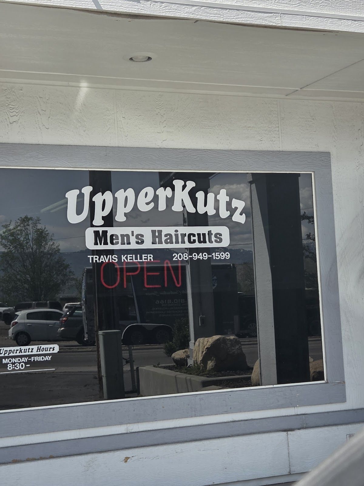UpperKutz Men's Haircuts window, Travis Keller, open for walk-ins